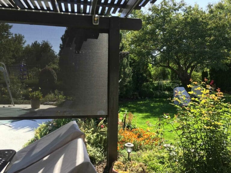 exterior screens installed near the garden Patio Covers Unlimited